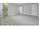 Spacious bedroom with gray walls and wood-look flooring at 12117 Topaz St, Spring Hill, FL 34608