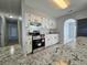 Modern kitchen with stainless steel appliances and granite counters at 12117 Topaz St, Spring Hill, FL 34608