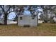 Gray storage shed with steps in backyard at 12117 Topaz St, Spring Hill, FL 34608