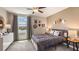 Spacious bedroom with a metal bed frame and western decor at 30908 Wild Juniper Ct, Brooksville, FL 34602