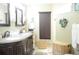 Bathroom with double vanity and granite countertops at 812 Walsingham Way, Valrico, FL 33594