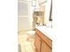 Clean bathroom with toilet, vanity, and a storage rack at 812 Walsingham Way, Valrico, FL 33594