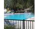 Inviting community pool with lounge chairs and shaded seating area at 812 Walsingham Way, Valrico, FL 33594