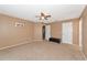 Bright bedroom with ceiling fan and ample closet space at 11847 Dunster Ln, Parrish, FL 34219