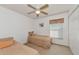 Cozy bedroom with twin beds and ceiling fan at 11847 Dunster Ln, Parrish, FL 34219