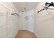 Walk-in closet with wire shelving and hanging rods at 11847 Dunster Ln, Parrish, FL 34219