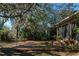 Wooden deck surrounded by lush landscaping at 11847 Dunster Ln, Parrish, FL 34219