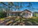 Back of house, showcasing a deck and screened porch at 11847 Dunster Ln, Parrish, FL 34219