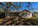 Back of house, showcasing a deck and screened porch at 11847 Dunster Ln, Parrish, FL 34219