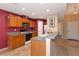 Kitchen boasts wood cabinets, granite countertops and a breakfast bar at 11847 Dunster Ln, Parrish, FL 34219