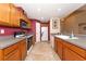Eat-in kitchen with wood cabinets, granite countertops, and stainless steel appliances at 11847 Dunster Ln, Parrish, FL 34219