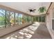 Bright screened porch with multiple windows at 11847 Dunster Ln, Parrish, FL 34219