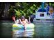 Relaxing view of a Personal floating on a tube in the river at 15057 Missouri Skylark Rd, Weeki Wachee, FL 34614