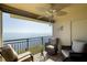 Relaxing balcony seating with beautiful water views, overhead fan, and tiled flooring at 6372 Palma Del Mar S Blvd # Apt 307, St Petersburg, FL 33715