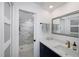Modern bathroom featuring a walk-in shower with sleek tile and a vanity with storage at 6372 Palma Del Mar S Blvd # Apt 307, St Petersburg, FL 33715