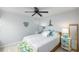 Cozy bedroom with coastal décor, a ceiling fan, and ample natural light at 6372 Palma Del Mar S Blvd # Apt 307, St Petersburg, FL 33715