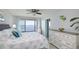 Serene bedroom featuring water view, dresser, and stylish blue accents at 6372 Palma Del Mar S Blvd # Apt 307, St Petersburg, FL 33715