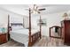 Bedroom with four-poster bed, ceiling fan, and ample space at 403 13Th Sw St, Ruskin, FL 33570