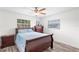 Bright bedroom with double bed, dresser and ceiling fan at 403 13Th Sw St, Ruskin, FL 33570