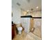 Large walk-in shower with tiled walls and mosaic floor at 403 13Th Sw St, Ruskin, FL 33570