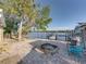 Brick patio with fire pit overlooking the water at 1422 Bayshore Rd, Ruskin, FL 33570