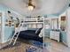 Guest bedroom with a bunk bed and coastal decor at 1422 Bayshore Rd, Ruskin, FL 33570