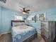 Cozy bedroom with a queen bed and light blue walls at 1422 Bayshore Rd, Ruskin, FL 33570