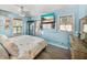 Main bedroom with light blue walls and coastal decor at 1422 Bayshore Rd, Ruskin, FL 33570