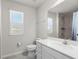 Clean bathroom with white vanity and tiled shower at 10662 Hawks Landing Dr, Land O Lakes, FL 34638