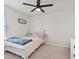 Cozy bedroom with a full-size bed and window at 10662 Hawks Landing Dr, Land O Lakes, FL 34638