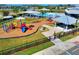 Community playground with play structures near pool at 10662 Hawks Landing Dr, Land O Lakes, FL 34638