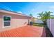 Private backyard with wooden deck and fenced area at 3051 27 E Ct, Palmetto, FL 34221