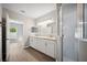 Double vanity bathroom with a shower and tub at 3051 27 E Ct, Palmetto, FL 34221