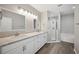 Double vanity bathroom with a shower and tub at 3051 27 E Ct, Palmetto, FL 34221