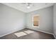 Bright bedroom with wood-look floors and window at 3051 27 E Ct, Palmetto, FL 34221