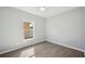 Well-lit bedroom featuring wood-look floors and a window at 3051 27 E Ct, Palmetto, FL 34221