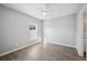 Spacious bedroom with wood-look floors and large window at 3051 27 E Ct, Palmetto, FL 34221