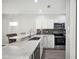 Modern kitchen with stainless steel appliances and granite countertops at 3051 27 E Ct, Palmetto, FL 34221
