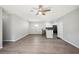 Open living area with kitchen island and wood-look floors at 3051 27 E Ct, Palmetto, FL 34221
