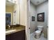 Powder room with single vanity and toilet at 5516 Luminar Pointe Ln, Apollo Beach, FL 33572