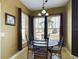 Bright breakfast nook with a round table and chairs, near a window at 5516 Luminar Pointe Ln, Apollo Beach, FL 33572