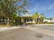 Yellow house with landscaping and palm trees at 5516 Luminar Pointe Ln, Apollo Beach, FL 33572