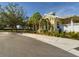 Yellow house with landscaping and palm trees at 5516 Luminar Pointe Ln, Apollo Beach, FL 33572