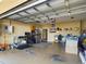 Spacious garage with ample storage and room for workshop at 5516 Luminar Pointe Ln, Apollo Beach, FL 33572