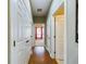 Light and bright hallway with hardwood floors at 5516 Luminar Pointe Ln, Apollo Beach, FL 33572