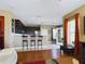 Modern kitchen with dark wood cabinets, stainless steel appliances, and a breakfast bar at 5516 Luminar Pointe Ln, Apollo Beach, FL 33572