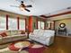 Spacious living room with hardwood floors, white couches, and a ceiling fan at 5516 Luminar Pointe Ln, Apollo Beach, FL 33572