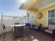 Brick patio with table, chairs, and seating area at 5516 Luminar Pointe Ln, Apollo Beach, FL 33572