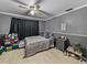 Bedroom with double bed, dresser, and ceiling fan at 1008 Highgrove Ct, Valrico, FL 33596