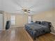 Spacious Primary bedroom with king-size bed and ceiling fan at 1008 Highgrove Ct, Valrico, FL 33596